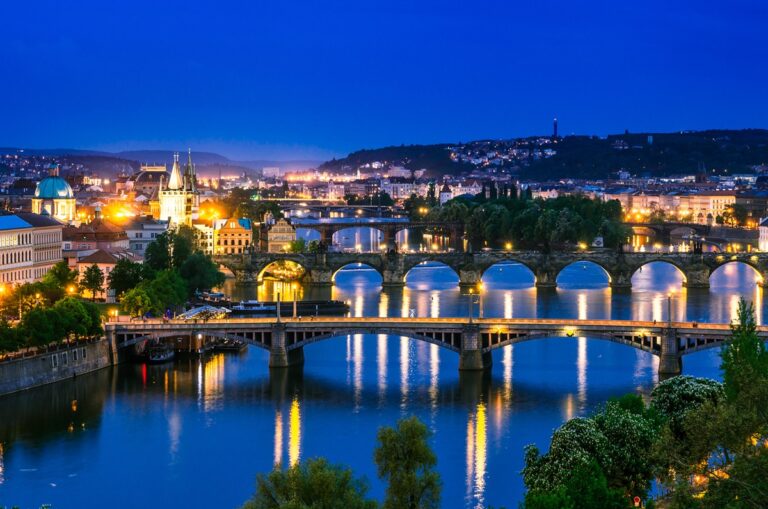 Night view over the Vltava river and bridges in Prague at sunset, Czech Republic